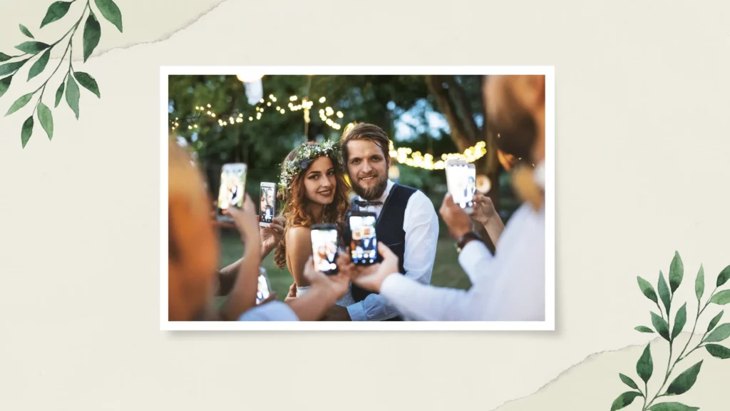 A group of wedding guests takes pictures at a wedding