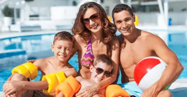 family next to a pool