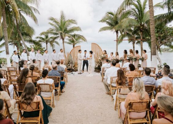 Destination Wedding with palm tree and ocean in the background
