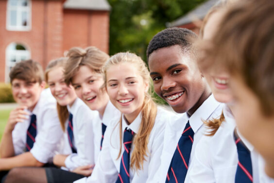 high school kids sitting down outside